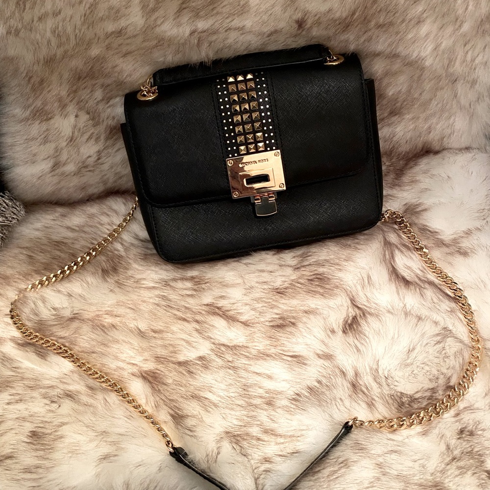 Michael Kors black leather purse. Cross body gold chain.